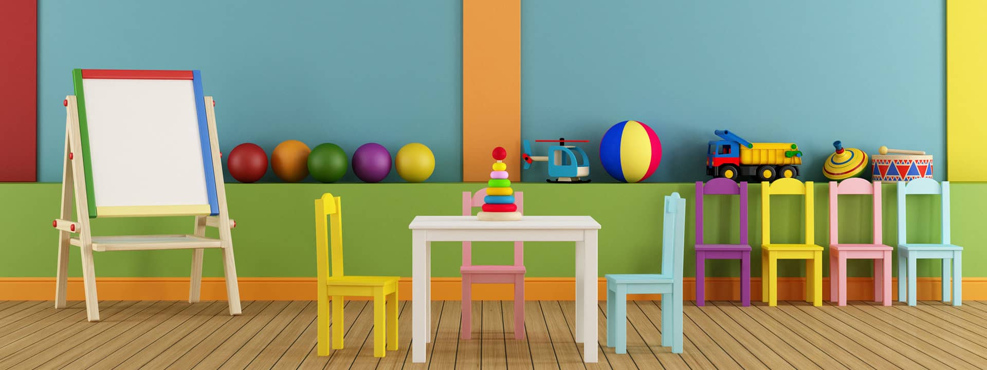 Colorful children's play area with small chairs, table, and toys at Iowa Childcare Resource & Reref.